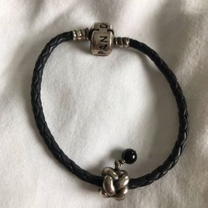 Discontinued Pandora charm on black leather